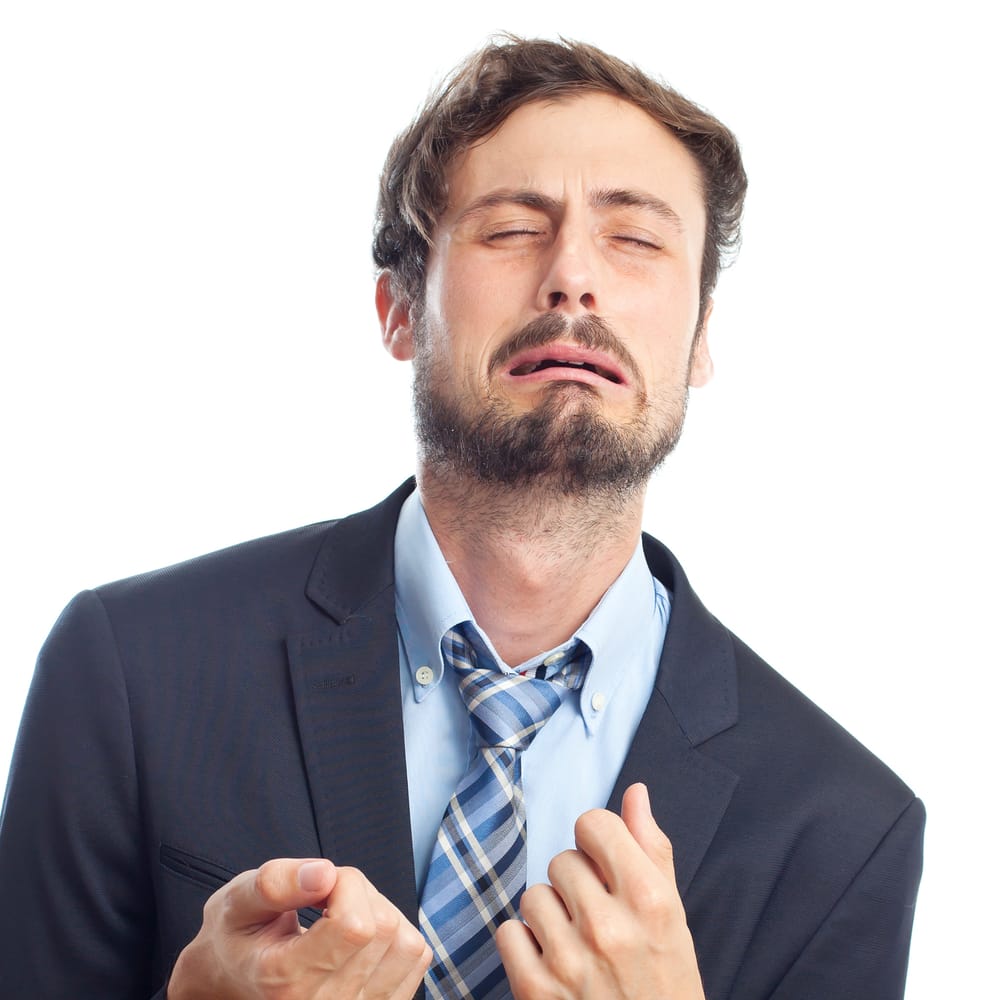 shutterstock_229456597 young crazy businessman crying